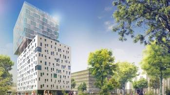 La tour de bureaux Innova à Bordeaux, surplombée d'un bloc résidentiel © Carle